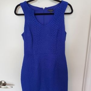 Blue body con dress with unique neckline